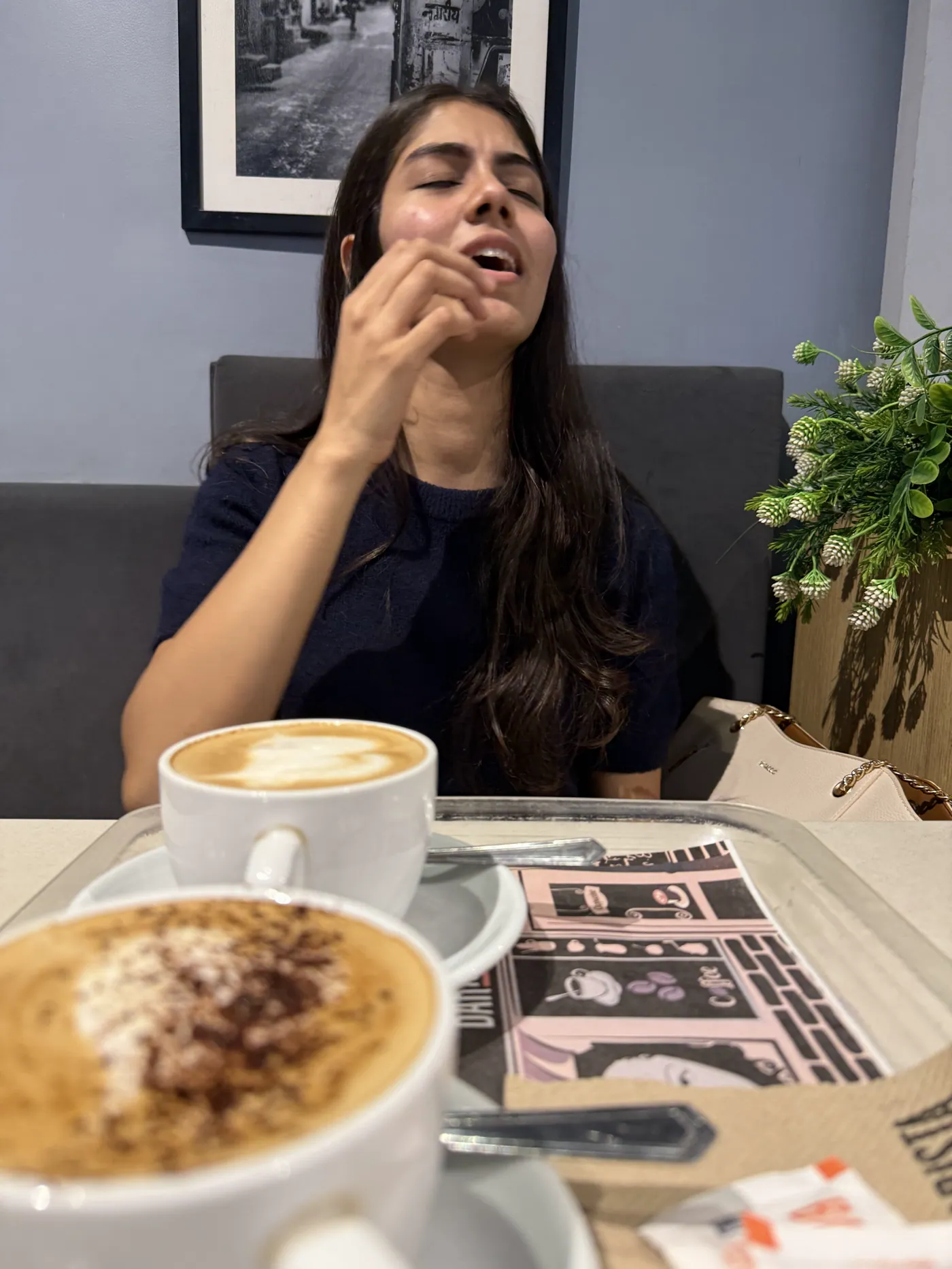 Aiko laughing at a cafe